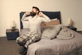 Problem with early morning awakening. Get up early. Tips for waking up early. Man bearded hipster sleepy face pajamas Royalty Free Stock Photo