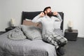 Problem with early morning awakening. Get up early. Tips for waking up early. Man bearded hipster sleepy face pajamas Royalty Free Stock Photo