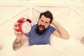 Problem early morning awakening. Why you suffering in mornings. Get up with alarm clock. Waking up early. Man bearded