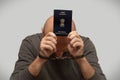 The problem of illegal immigration of refugees from India, an Indian immigrant in handcuffs with a passport in his hands. Illegal Royalty Free Stock Photo