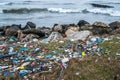 The problem of pollution and ecology of the sea shore and the ocean. Garbage on the coastline and in the world Royalty Free Stock Photo