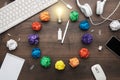 Top view of an office table with great idea concept. problem solution concept depicted by colorful crumpled paper and light bulb