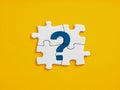Problem solving, brainstorming and team effort for creative solutions in business. FAQ. Question mark icon on connected jigsaw Royalty Free Stock Photo