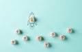 Problem solving and startup launch concept. A conceptual image of a rocket with a lightbulb taking off, surrounded by cubes with