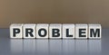 Problem - word on wooden cubes on a beautiful gray background