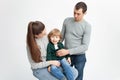 Problems in family, divorce, child is naughty, shkodly. family on white background isolated. Concept, lifestyle. child