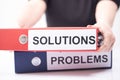 Problems and Solutions - two binders with text on desk in the office Royalty Free Stock Photo