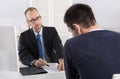 Problems at workplace: boss critic his employee because of his b Royalty Free Stock Photo