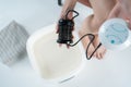 procedure of ionic detox foot bath machine in spa beauty center isolated Royalty Free Stock Photo