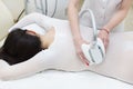 The procedure of lipomassage in a beauty salon