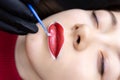 The procedure of permanent lip tattooing is applying matter to the lips anesthesia with a small brush