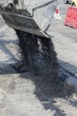 The process of asphalting roads. Machinery for asphalting roads. vertical photo Royalty Free Stock Photo