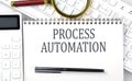 PROCESS AUTOMATION . Text on notepad with calculator and keyboard,business concept Royalty Free Stock Photo