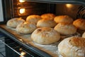 the process of baking round bread in the oven. Royalty Free Stock Photo