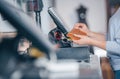 Process of barcode scanning on a goods in a shop, saleswoman selling a handbag to a customer Royalty Free Stock Photo