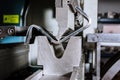 Sheet metal bending on a hydraulic bending machine. Metal part after bending Royalty Free Stock Photo