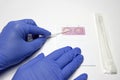 Process of biological sample collection using a cotton swab in a DNA analysis kit