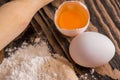 Process of Bread cooking. Preparation of dough for baking pies, bread, rolls and biscuits. Flour with eggs on a wooden Royalty Free Stock Photo