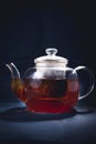 Process brewing tea,tea ceremony,Cup of freshly brewed black tea,warm soft light, darker background
