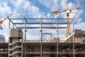 The process of building multi-storey parking for cars. Concrete interior of unfinished parking area.