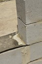 Laying cinder block wall thickness of the stone on the waterproofing close-up.