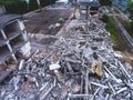 A process of buliding demolition, demolished house, shot from air with drone