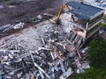A process of buliding demolition, demolished house, shot from air with drone