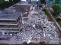 A process of buliding demolition, demolished house, shot from air with drone
