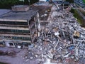 A process of buliding demolition, demolished house, shot from air with drone