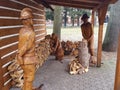 Process of carving figures in wood for decorating recreation areas Royalty Free Stock Photo
