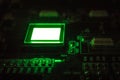 The process of checking several oled displays on the test station. Displays glow brightly of green color close up