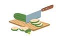 Process of chopping zucchini into ring slices with metal chopper knife on wood board. Cutting fresh vegetable ingredient