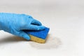 Cleaning company person Hands in rubber gloves do Mattress chemical cleaning. The process of cleaning with the help of a sponge Royalty Free Stock Photo