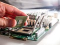 The process of connecting the CPU to the processor socket on a modern computer motherboard, replacing the silicon data processing Royalty Free Stock Photo