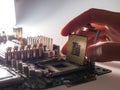 The process of connecting the CPU to the processor socket on a modern computer motherboard, replacing the silicon data processing Royalty Free Stock Photo
