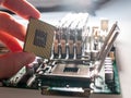 The process of connecting the CPU to the processor socket on a modern computer motherboard, replacing the silicon data processing Royalty Free Stock Photo