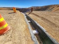 Process of constructing channels with geosynthetics in open-pit mine benches Royalty Free Stock Photo