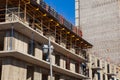 The process of construction of multistory monolithic building. Concrete and metal frame of floor slabs and columns