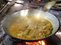 the process of cooking rendang or beef and chicken curry using the traditional method, cooking using firewood