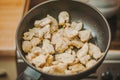 The process of cooking chicken breast diet for an athlete in a frying pan in sunflower oil. Meat for muscle recovery after Royalty Free Stock Photo