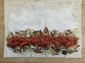 The process of cooking chicken wrap on kitchen table at home concept. Homemade kebab close up Royalty Free Stock Photo