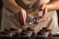 Process of cooking cocoa muffins. Pastry chef prepares chocolate mousxes with nut filling