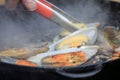 The process of cooking fried mussels in a frying pan Royalty Free Stock Photo