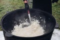 Process of cooking healthy onion in cauldron