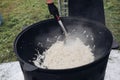 Process of cooking healthy onion in cauldron