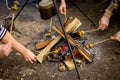 Process of cooking mushrooms on bonfire Royalty Free Stock Photo