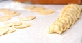 The process of cooking pelmeni, dumplings with cutting the base for modeling and finished pelmeni.
