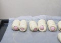 The process of cooking sausages in the dough in the home kitchen. Royalty Free Stock Photo