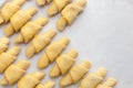 Process of cooking small croissants with cerry for breakfast. Preparation of baking on a rustic white background