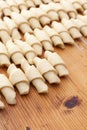 Process of cooking small croissants with cerry for breakfast. Preparation of baking on a rustic wooden background